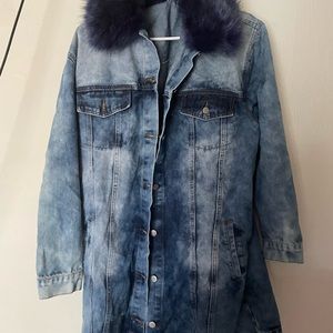 Acid wash denim jacket with a blue fur collar.